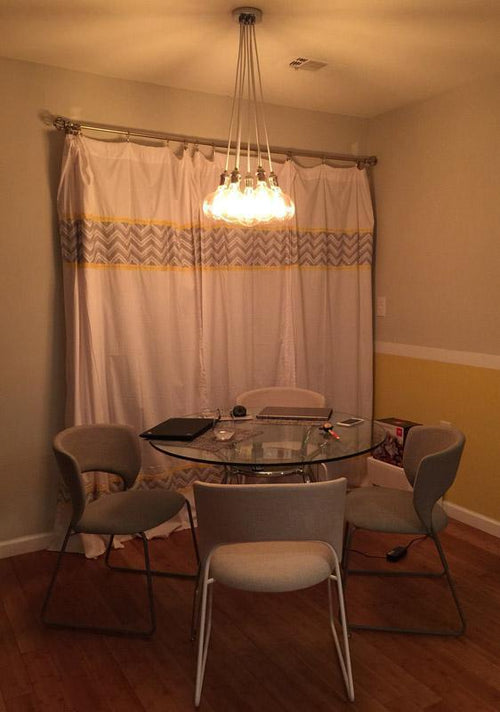 White and Chrome Cluster over a Dining Table  light fixture