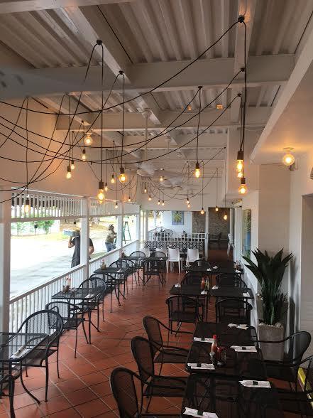 Multiple Swag Chandeliers on a Restaurant Porch  light fixture